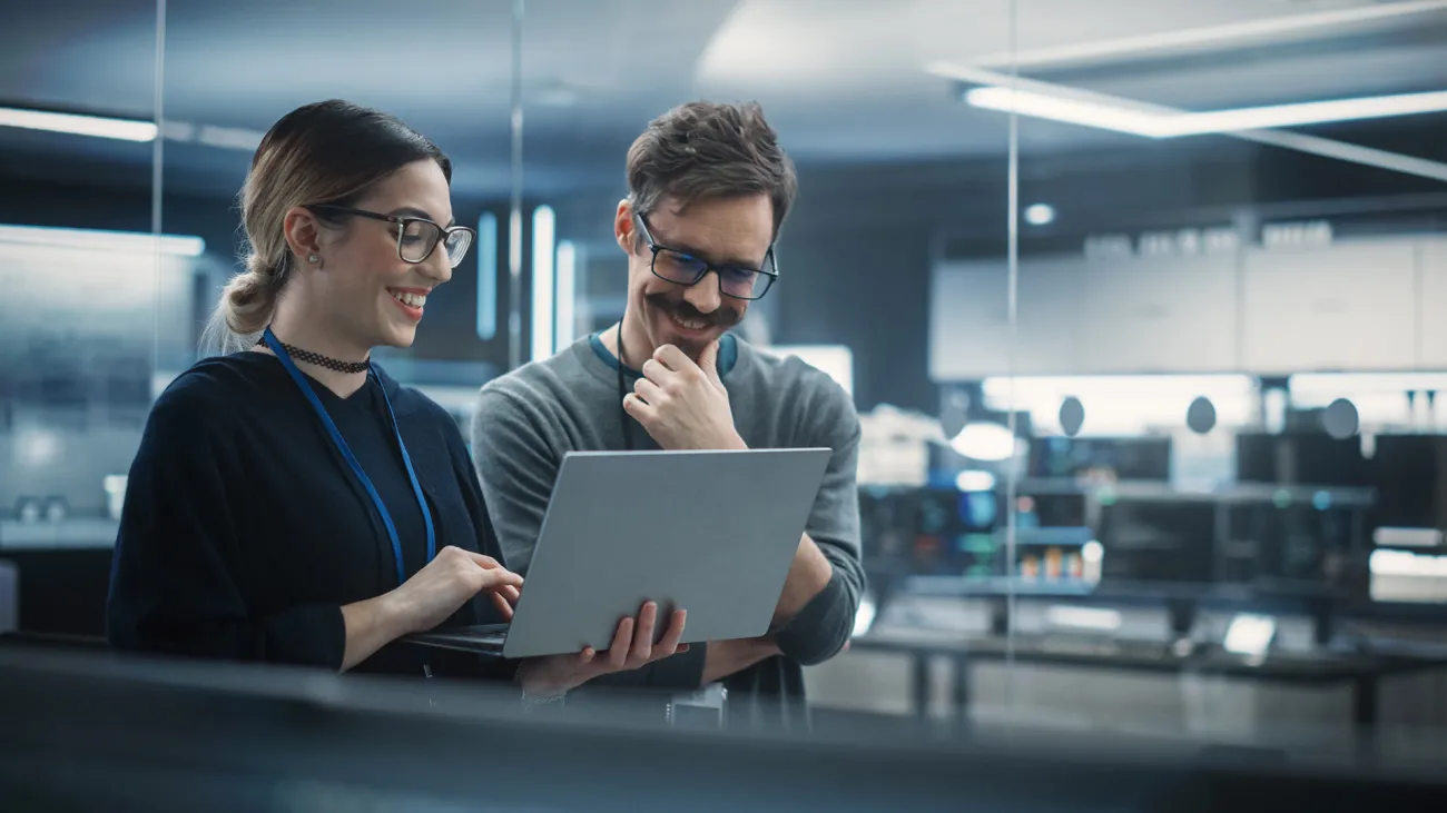 colleagues looking at laptop