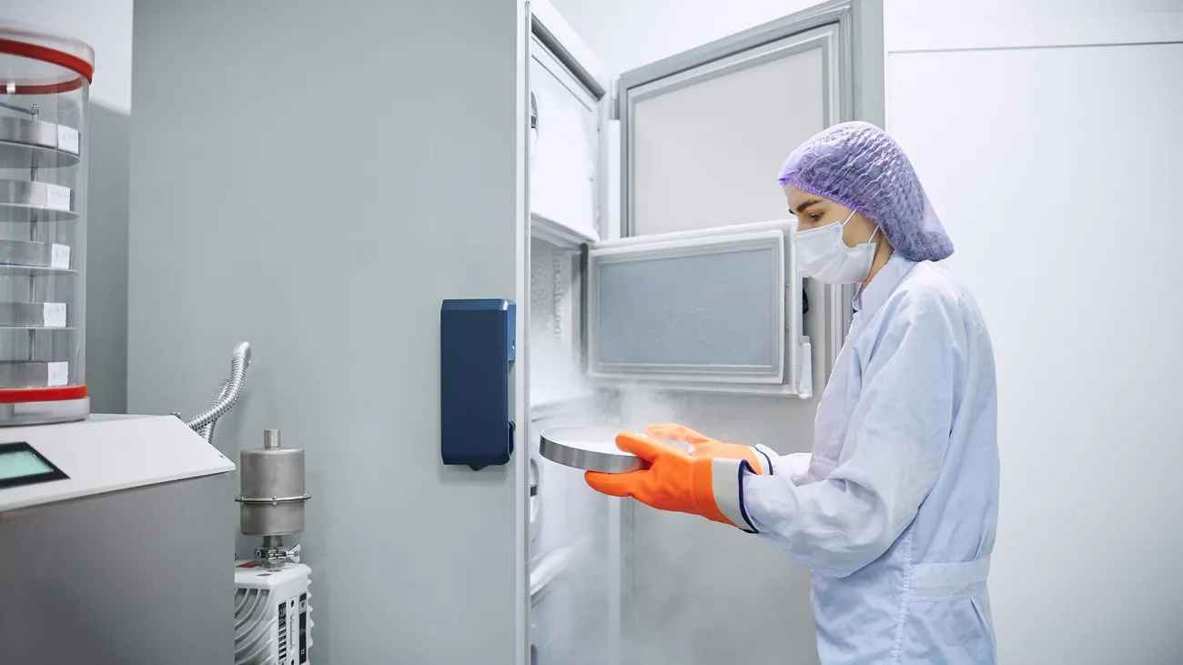 person removing material from cold storage