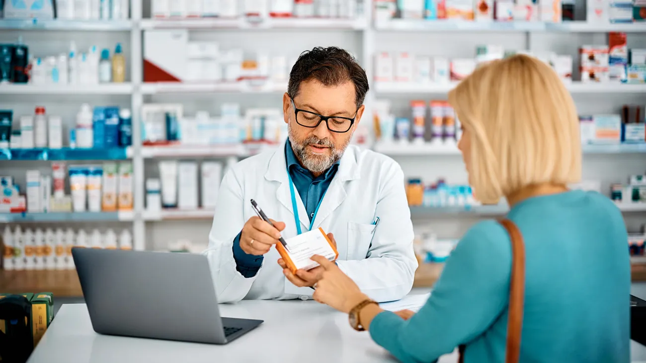 pharmacist assisting customer