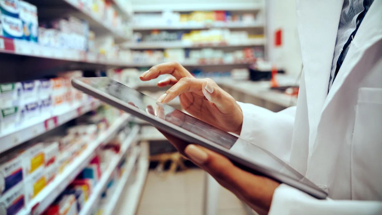 hands of pharmacist on tablet