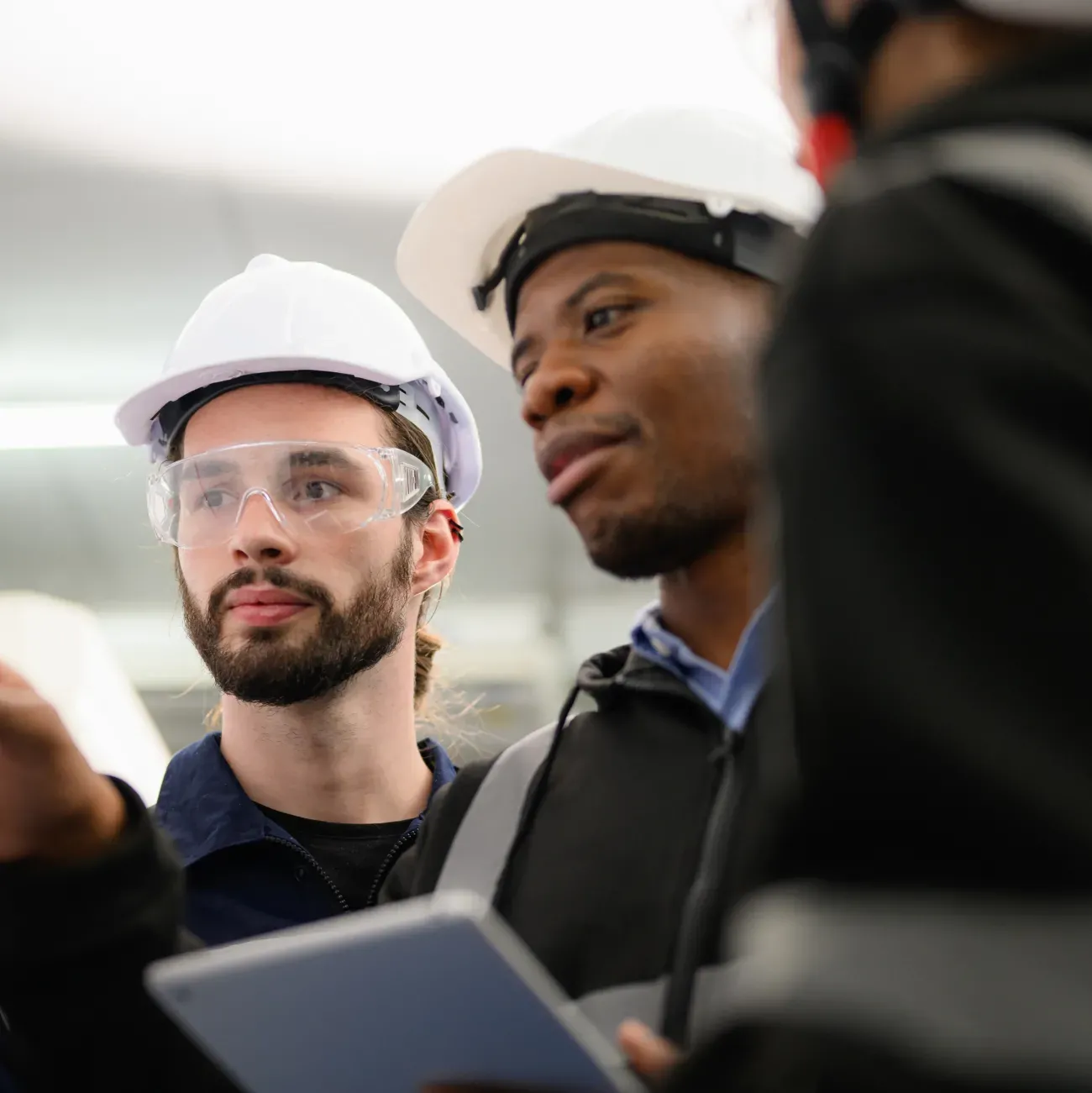 Two men with hard hats