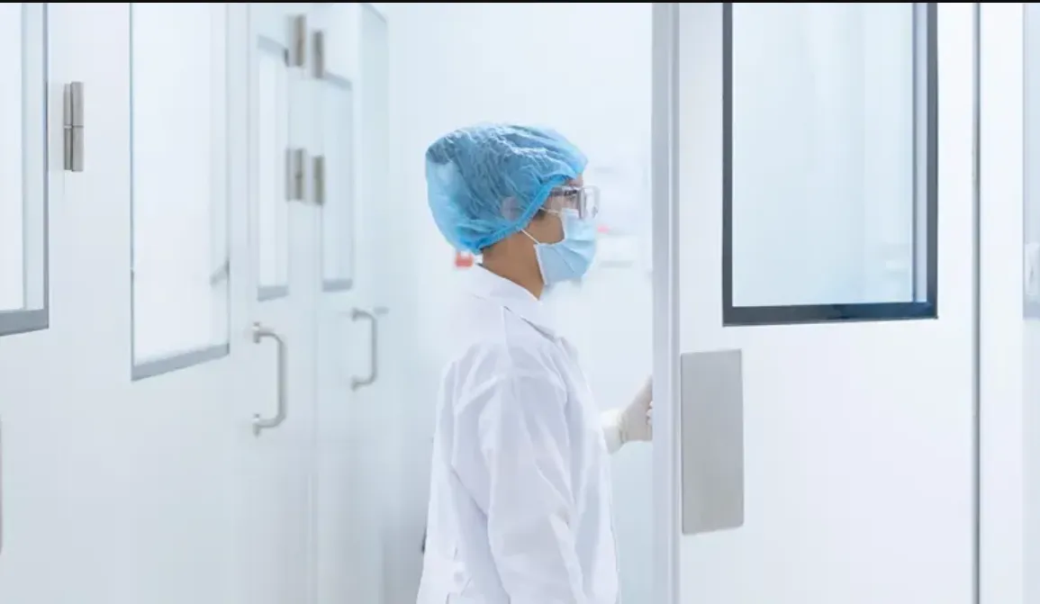 scientist entering cleanroom