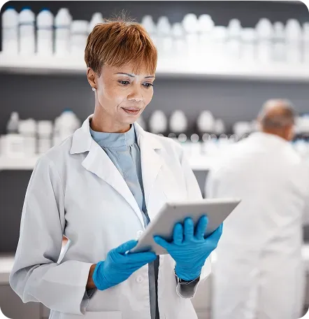 woman in lab looking at ipad