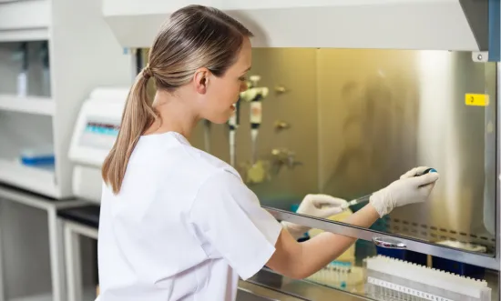 researcher filling liquid in laboratory